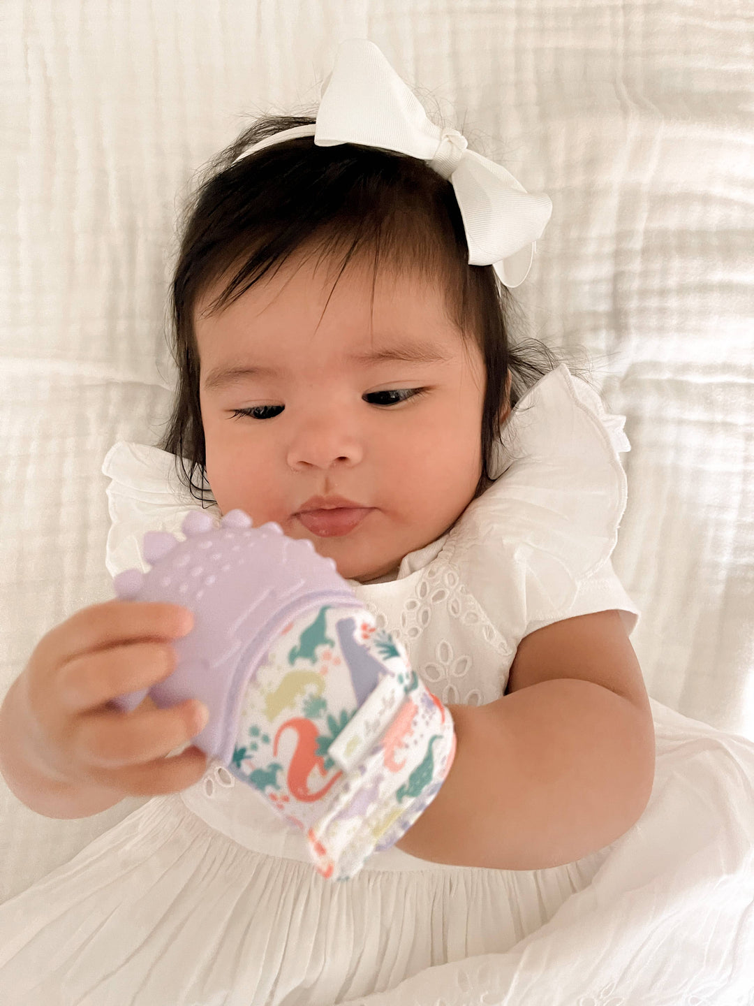 Itzy Mitt™ Silicone Teething Mitts: Highland Cow - Premium teethers from Itzy Ritzy - Just $9.95! Shop now at Pat's Monograms